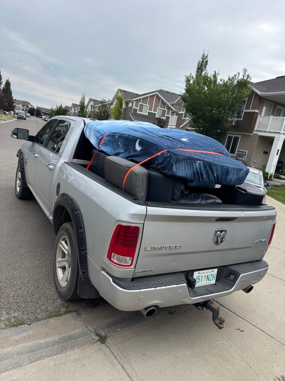 Pickup truck loaded with a couch and mattress in Regina