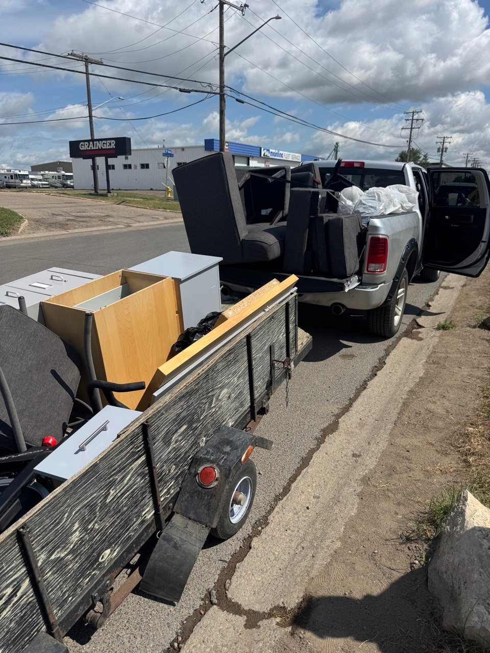 Truck and trailer loaded with old office furniture in Regina